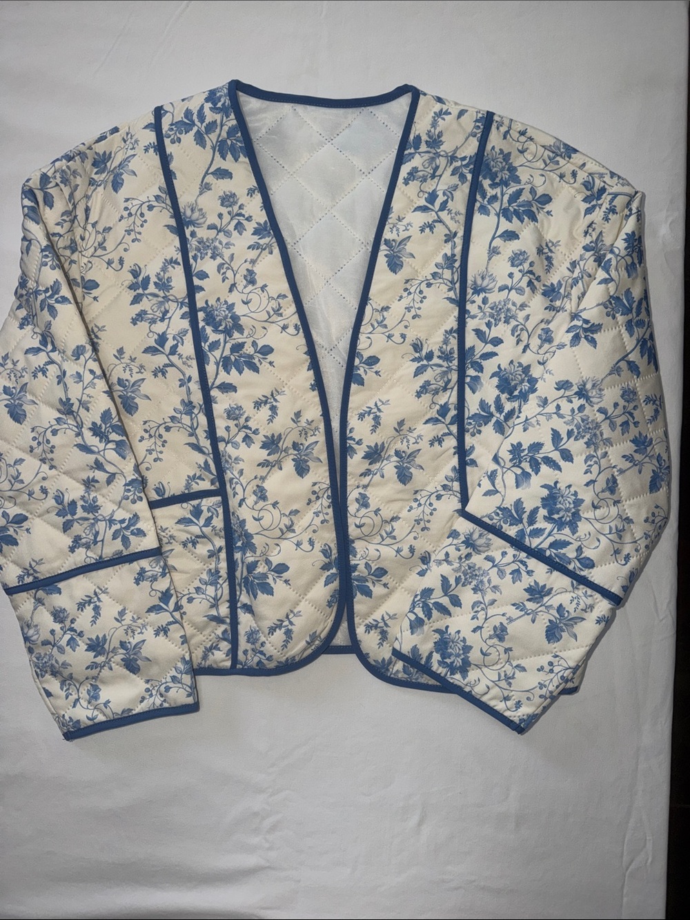 SHEIN Blue Floral Quilted Bomber Jacket on Cream